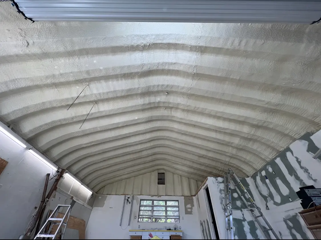 Spray polyurethane foam applied to the underside of a metal roof deck in University of California-Davis